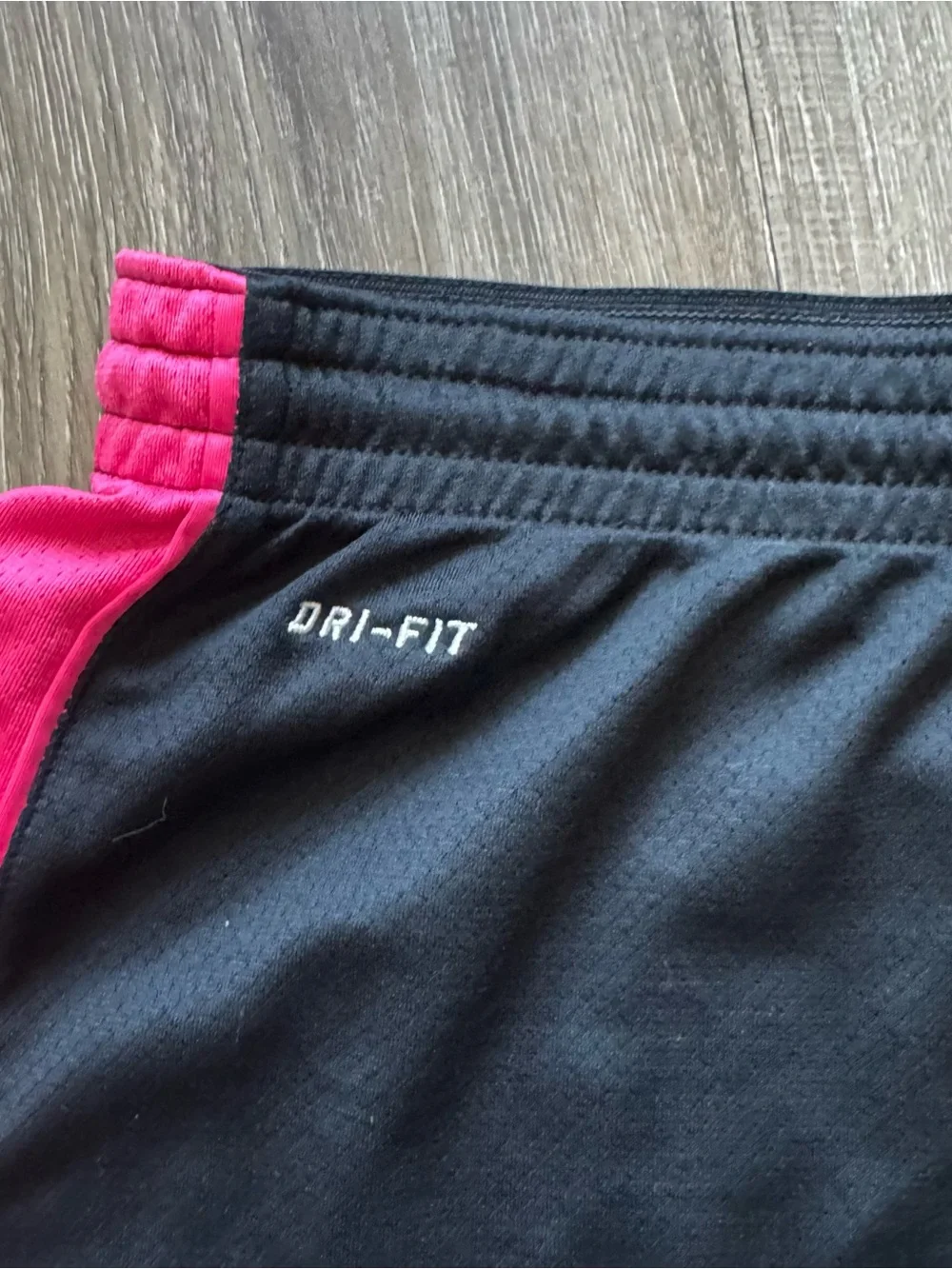 Nike Women's Black Shorts with Hot Pink Side Panels